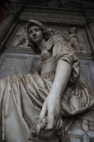 Magnificent Italian sculpture of a girl in armor in the city of Bologna © BALLDASSARO
