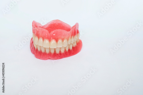 Two acrylic dentures ,white background. Copy space.