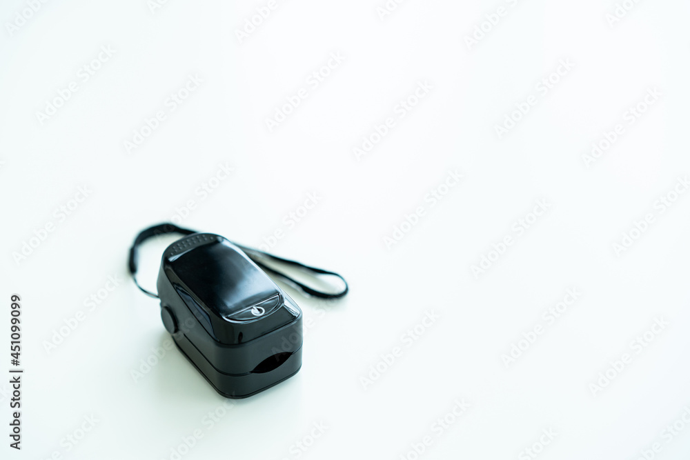 Portable digital blood oxygen saturation - pulse meter close up with copyspace. Portable digital blood oxygen saturation - pulse meter close up with copyspace.