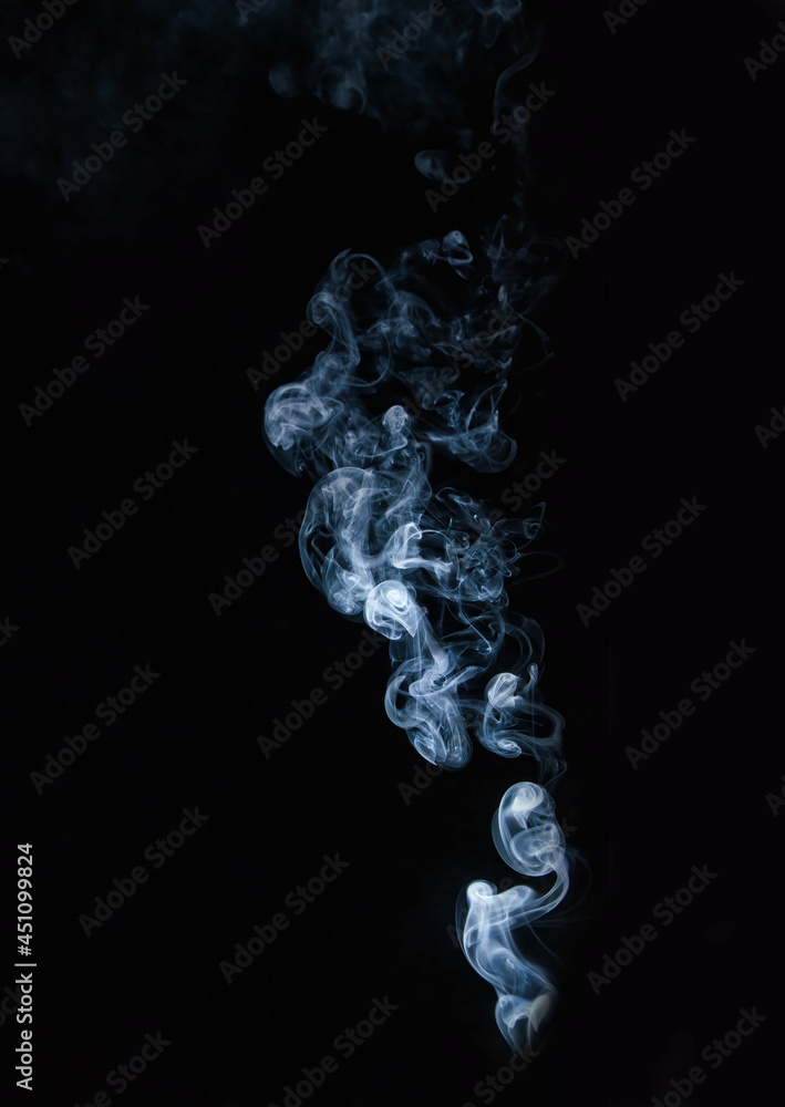 Isolated blue white wood burning smoke with black background for special overlay effects Isolated blue white wood burning smoke with black background for special overlay effects