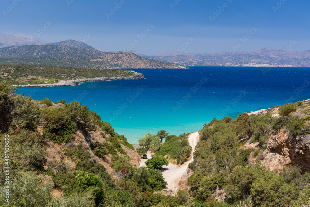 Beautiful clear, warm ocean and dry, summer coastline at Voulisma, Crete, Greece