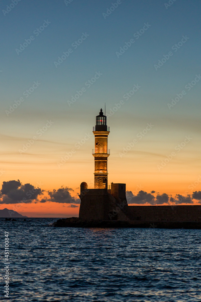 Old lighthouse at the ancient Venetian port of Chania (Greece) at dusk