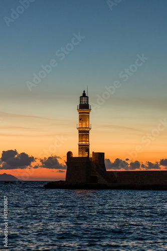 Old lighthouse at the ancient Venetian port of Chania (Greece) at dusk