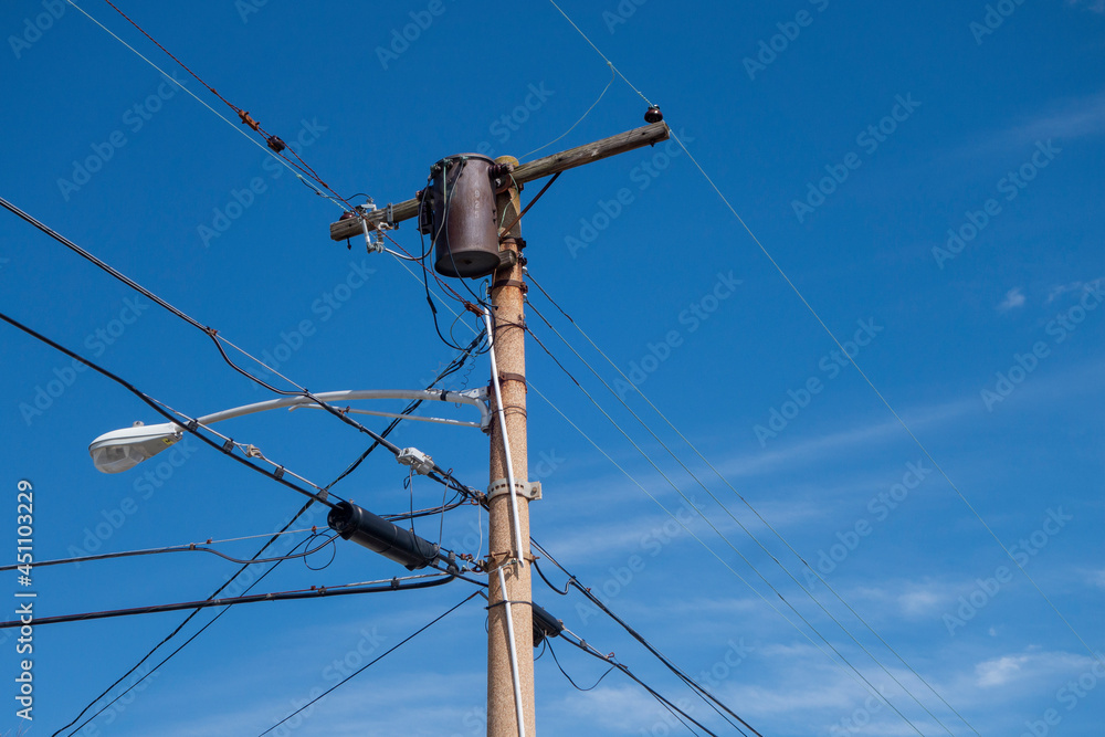 Power wooded pole with wires