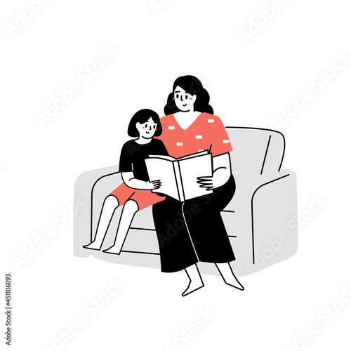 The mother read a book to the kid. Reading a book. Family time. Reading to kids. Home reading literature