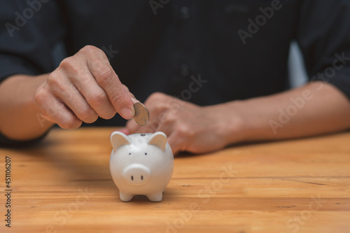 Saving and pig piggy bank a coin glass on the floor