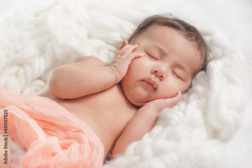 lovely baby boy sleeping on bed and hand holding face lovely baby boy sleeping on bed and hand holding face