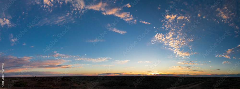 Setting Sun and whispy clouds in the Australian Outback