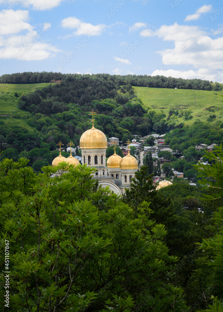 St. Nicholas Christian Church in the city of Kislovodsk, Russia, built in 1888, among dense trees