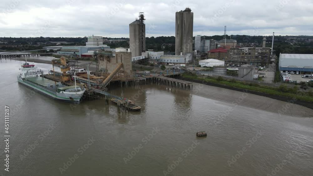 Ship Loading at jetty Hanson Ready-mixed Concrete site Erith Kent UK Aerial footage Ship Loading at jetty Hanson Ready-mixed Concrete site Erith Kent UK Aerial footage
