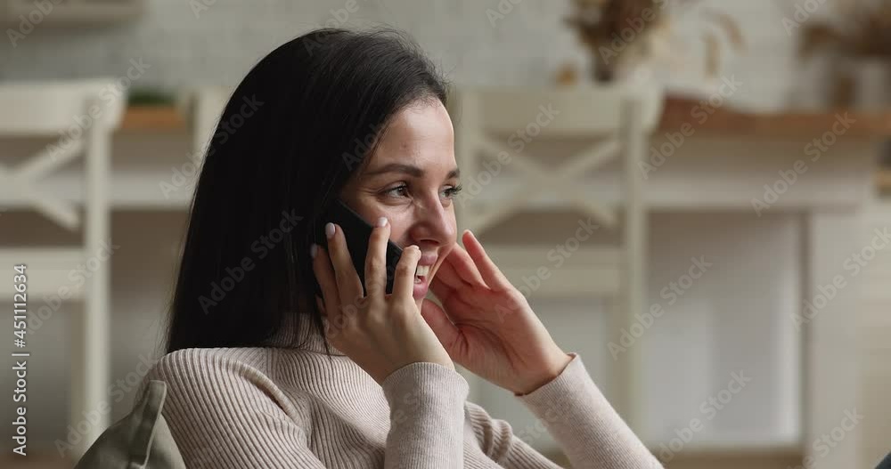 Head shot smiling millennial generation relaxed woman holding pleasant phone call conversation, talking sharing life news with friends, communicating distantly with family, resting alone at home