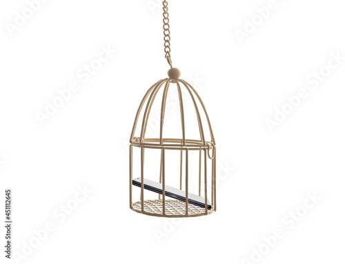 Smartphone in the cage on white background. Communication during the restricted lockdown. Social isolation and remote distance concept. Mobile phone abuse and addiction. Media blocking. Digital detox.