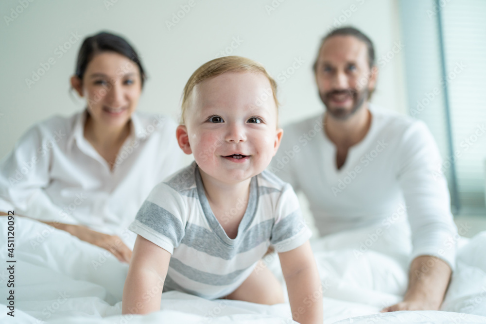 Portrait of Caucasian happy family smiling, look at camera in bedroom. Portrait of Caucasian happy family smiling, look at camera in bedroom.
