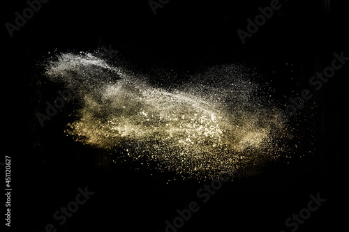 golden powder splash in black background