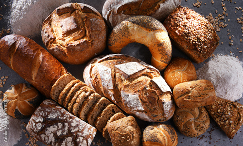 Photographie Assorted bakery products including loafs of bread and rolls
