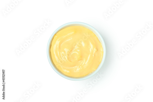 Bowl with cheese sauce isolated on white background
