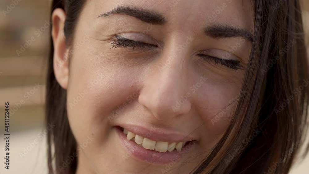 Outdoor portrait of a Hispanic woman looking at smiling camera. Close-up of a happy face. Concept of people and emotions. Outdoor portrait of a Hispanic woman looking at smiling camera. Close-up of a happy face. Concept of people and emotions.
