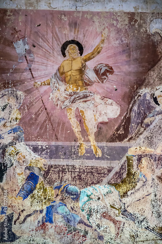 illustrations from the bible on the wall of an abandoned temple