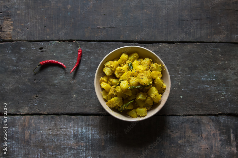 Aloo posto or potatoes fried with poppy seeds, a famous Bengali cuisine ...