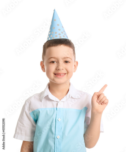 Little boy in party hat poi...