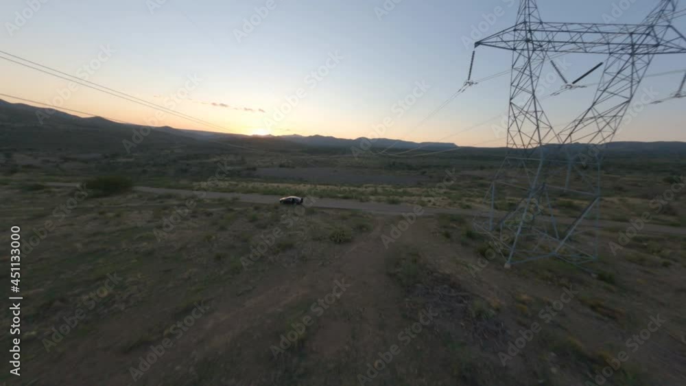 First person view powerlines in Arizona desert sunset. Beautiful powerline footage shot on an FPV drone with a go-pro hero 9 attached. First person view powerlines in Arizona desert sunset. Beautiful powerline footage shot on an FPV drone with a go-pro hero 9 attached.