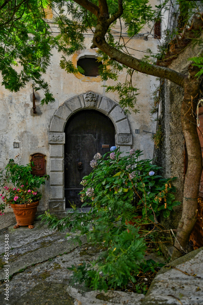 The facade of an old house in the historic center of Maratea, a medieval town in the Basilicata region, Italy.