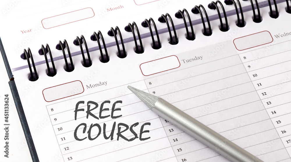 FREE COURSE on the planner with pencil, business concept FREE COURSE on the planner with pencil, business concept
