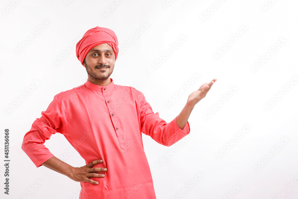 Young indian farmer giving expression on white background.