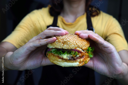 Chef holding a beef burger