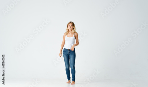woman barefoot on the floor jeans movement dance energy