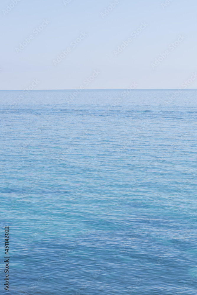 Vertical seascape. Light sea background