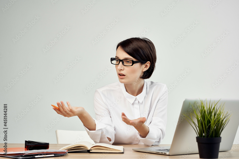 Businesswoman at the desk with glasses self-confidence Studio Lifestyle Businesswoman at the desk with glasses self-confidence Studio Lifestyle