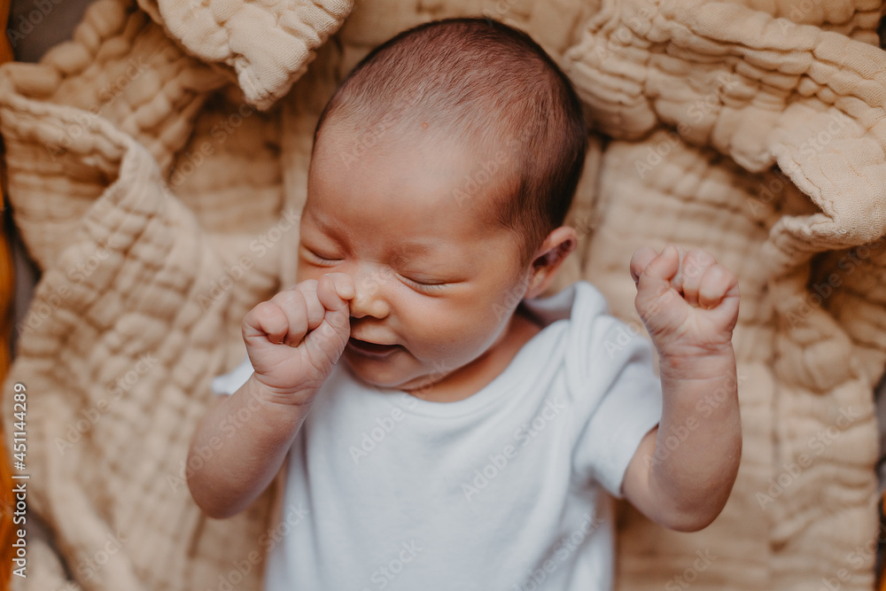 portrait of a cute newborn baby who just woke up, bubbling and stretching - obrazy, fototapety, plakaty 