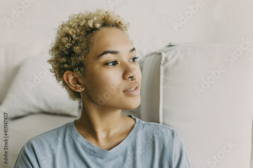Slika na platnu Portrait of mixed race curly-headed girl with natural beauty without make-up wea