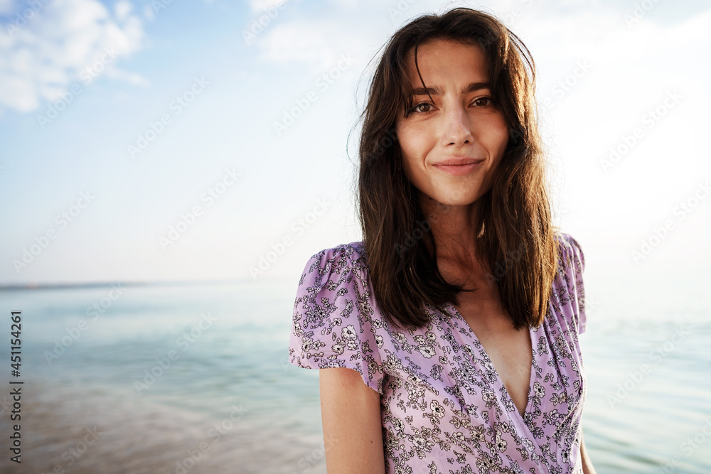 Happy woman on the beach walking by seaside Happy woman on the beach walking by seaside