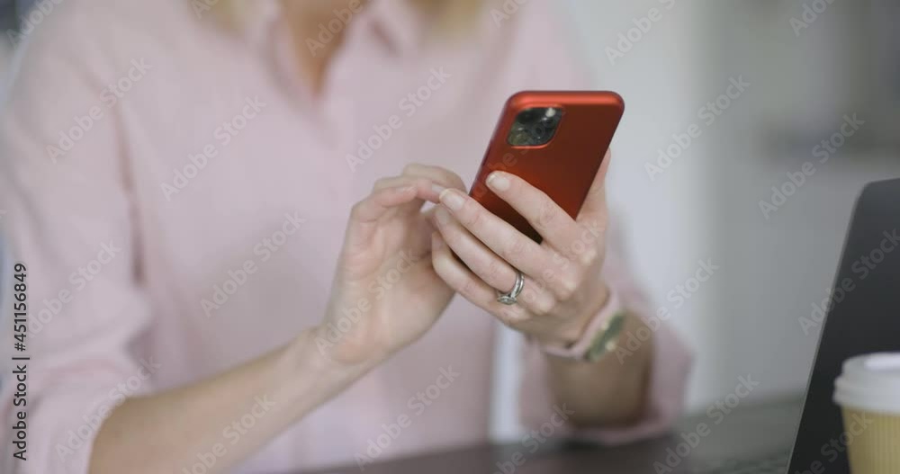 Hands of woman text messaging on smartphone Hands of woman text messaging on smartphone