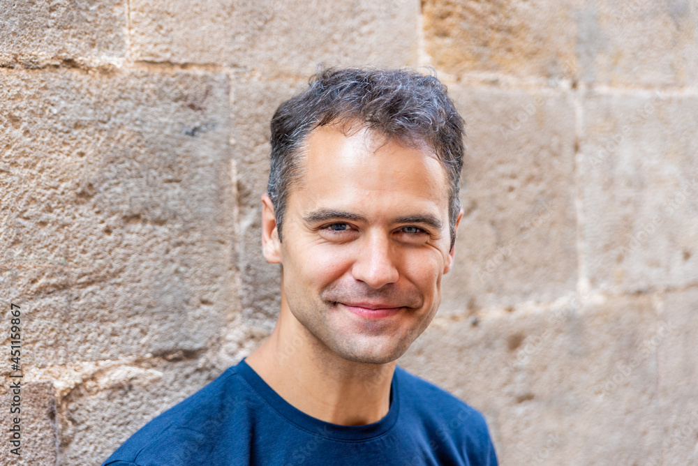 Close up portrait of smiling latin man with heterochromia Close up portrait of smiling latin man with heterochromia