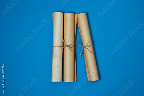 Old scrolls on a blue background. Knowledge and education concept. There is a place for an inscription or logo