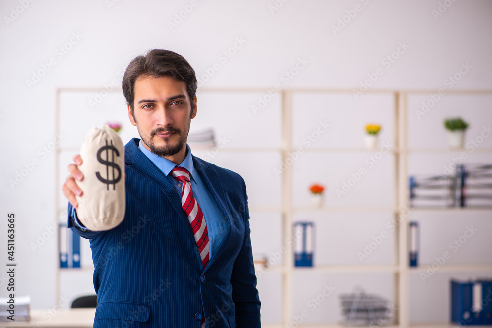 Young male employee in remuneration concept