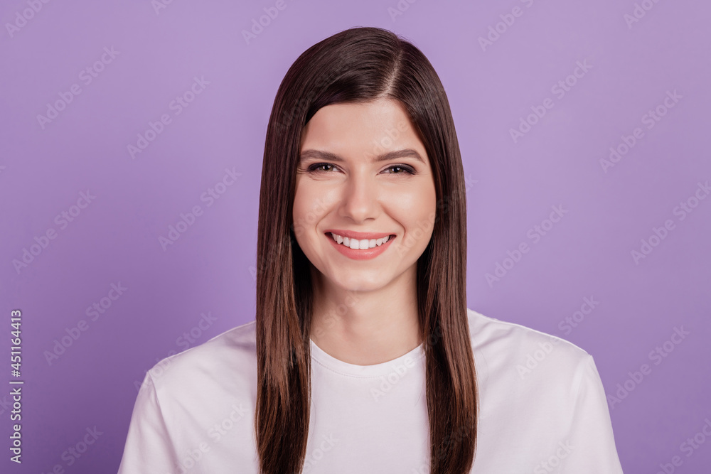 Fototapeta premium Portrait of young woman happy smile isolated over violet background