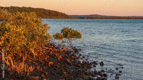Sunset over the bay at River Heads, With Frazer Island in the distance. 