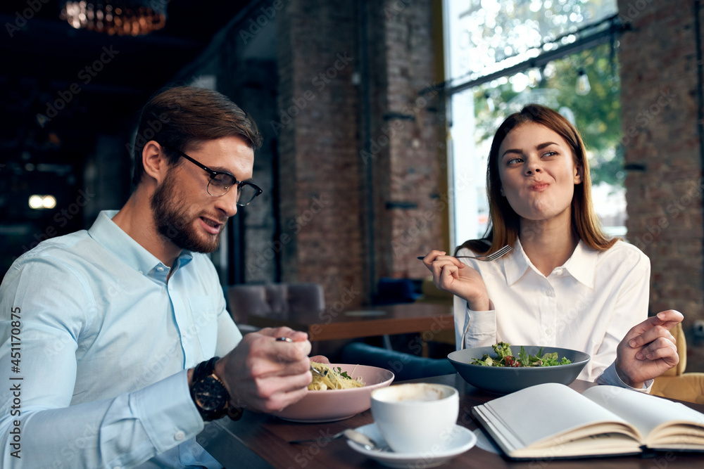 business man and woman sitting in cafe lunch communication lifestyle