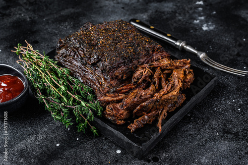 Texas Style BBQ Smoked Beef Brisket meat steak. Black background. Top view