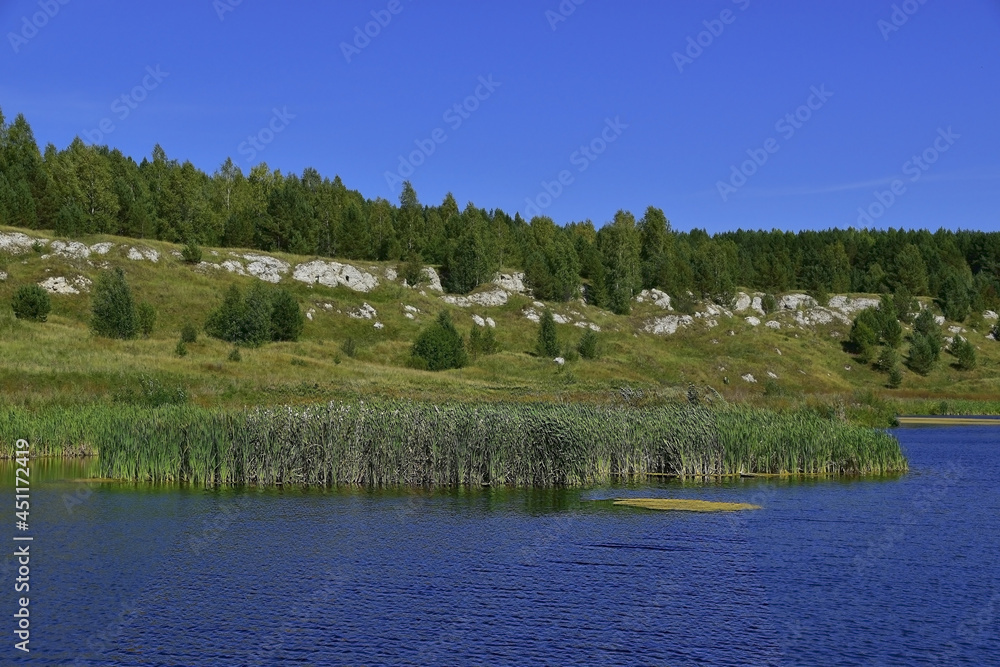 Rocky outcrops of white gypsum along the banks. Rocky outcrops of white gypsum along the banks.