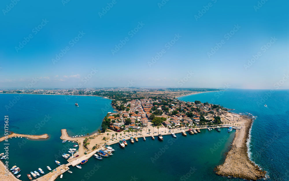 Wide panorama. Aerial view of the bay, ships and boats. Touristic place, ancient buildings, the Colosseum and the Temple of Apollo. Turkey, Manavgad, Side. Copy space