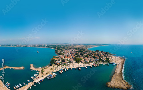 Wide panorama. Aerial view of the bay  ships and boats. Touristic place  ancient buildings  the Colosseum and the Temple of Apollo. Turkey  Manavgad  Side. Copy space