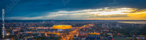 Panorama of Gdansk with the illuminated stadium at sunset. Poland.