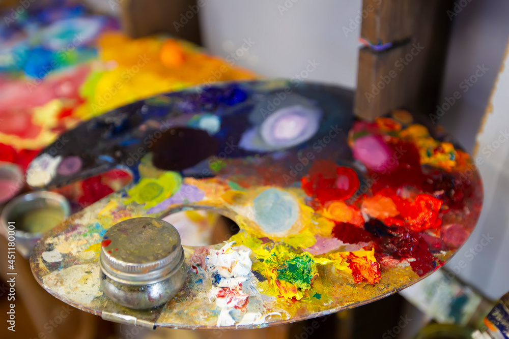 A palette of oil paints. Artist Desktop A palette of oil paints. Artist Desktop