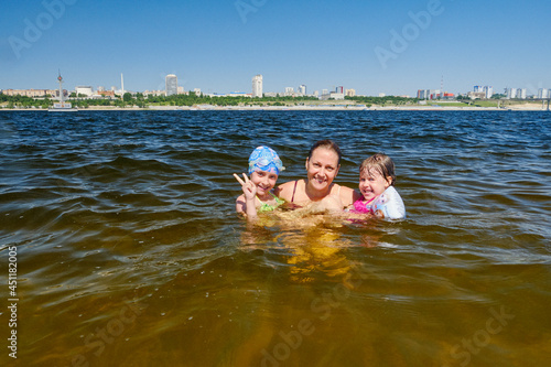 Children's summer vacation on the water with their parents.