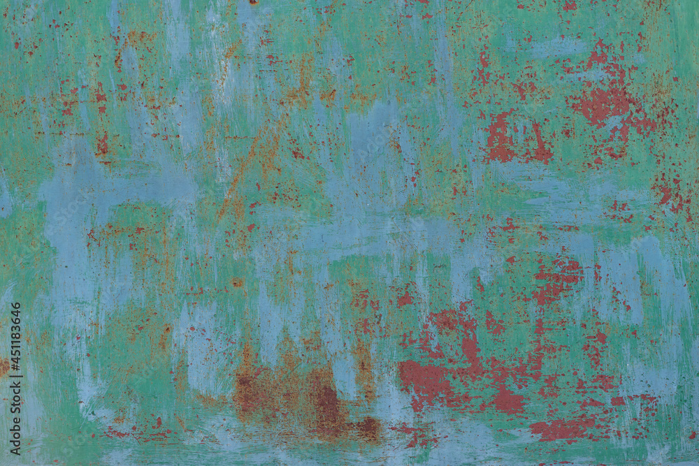 Painted in green old cracked metal rusted background. Metal texture. Erosion metal. Scratched and dirty texture on outdoor metal wall. Painted in green old cracked metal rusted background. Metal texture. Erosion metal. Scratched and dirty texture on outdoor metal wall.